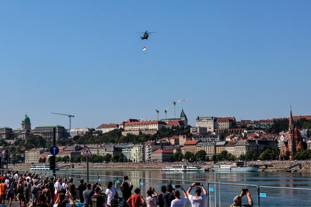 (260820) -- BUDAPEST, Aug. 20, 2026 (Xinhua) -- A Hungarian Air Force helicopter participates in a military air parade over the Danube in Budapest, Hungary, on Aug. 20, 2026. Hungary marks its national day on Thursday with traditional ceremonies, music concerts, and a redesigned evening spectacle in Budapest. (Photo by David Balogh/Xinhua)