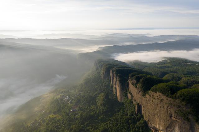 (260820) -- JIAN'GE, Aug. 20, 2026 (Xinhua) -- An aerial drone photo taken on Aug. 20, 2026 shows the Jianmen Pass shrouded in clouds and mist in Jian'ge County, Guangyuan City of southwest China's Sichuan Province. (Xinhua/Jiang Hongjing)
