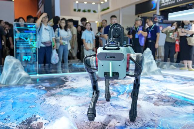 (260820) -- BEIJING, Aug. 20, 2026 (Xinhua) -- A robot designed for inspection and transportation is displayed at the 2026 World Robot Conference (WRC) in Beijing, capital of China, Aug. 20, 2026. Opened in Beijing on Wednesday, the 2026 WRC features more than 300 exhibitors and over 2,000 exhibits under the theme "Human-Robot Symbiosis, Production-Demand Convergence." The conference showcases solutions for manufacturing, food service and retail, healthcare and elderly care, emergency rescue and other fields. (Xinhua/Ju Huanzong)