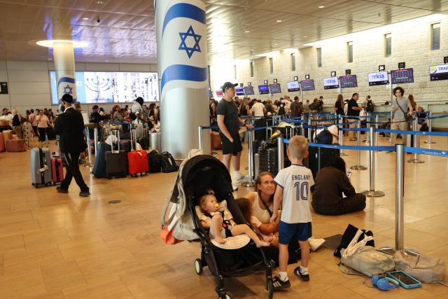 (260820) -- TEL AVIV, Aug. 20, 2026 (Xinhua) -- Stranded passengers wait at the Ben Gurion International Airport near Tel Aviv, Israel, Aug. 20, 2026. Takeoffs from Israel's Ben Gurion International Airport were halted on Thursday due to a sudden strike, according to a statement from the Israel Airports Authority and media reports. (Photo by Gil Cohen Magen/Xinhua)