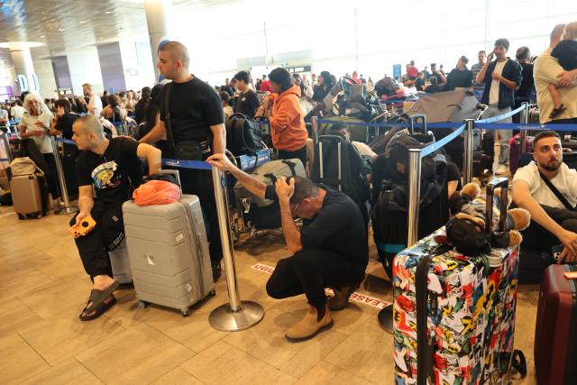 (260820) -- TEL AVIV, Aug. 20, 2026 (Xinhua) -- Stranded passengers wait at the Ben Gurion International Airport near Tel Aviv, Israel, Aug. 20, 2026. Takeoffs from Israel's Ben Gurion International Airport were halted on Thursday due to a sudden strike, according to a statement from the Israel Airports Authority and media reports. (Photo by Gil Cohen Magen/Xinhua)