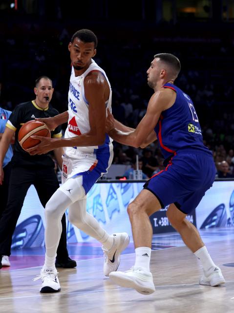 (260821) -- BELGRADE, Aug. 21, 2026 (Xinhua) -- France's Victor Wembanyama (C) vies with Serbia's Ognjen Dobric (R) during a friendly basketball match between Serbia and France in Belgrade, Serbia on August 20, 2026. (Photo by Djordje Kostic/Xinhua)