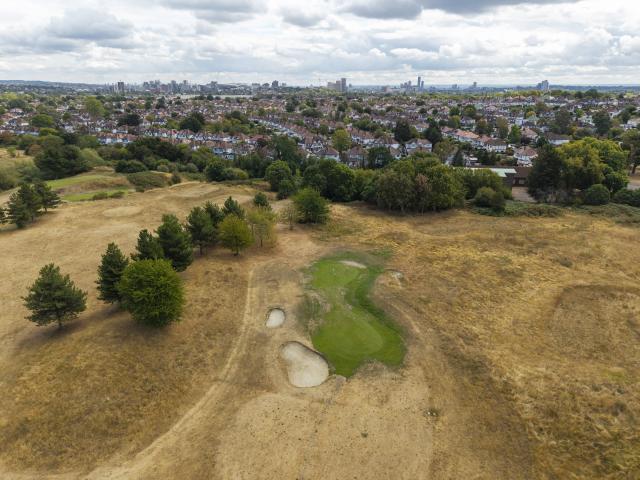 (260821) -- BEIJING, Aug. 21, 2026 (Xinhua) -- A drone photo taken on Aug. 19, 2026 shows parched grassland at Northwick Park in London, Britain. In Britain, extreme dryness has become a defining feature of the summer. Provisional data from the Met Office showed that England and Wales experienced their driest July on record, while nearly three-quarters of England was officially under drought conditions by Aug. 10. (Photo by Ray Tang/Xinhua)