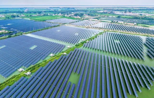 (260821) -- BEIJING, Aug. 21, 2026 (Xinhua) -- An aerial drone photo taken on Aug. 19, 2026 shows an aquaculture-photovoltaic hybrid project in Yangzhou, east China's Jiangsu Province. The overall installed capacity of photovoltaic power-generating facilities in Jiangsu has exceeded 100-gigawatt mark to reach 100.08 gigawatts by the end of July 2026, according to the State Grid Jiangsu Electric Power Company. (Photo by Ren Fei/Xinhua)