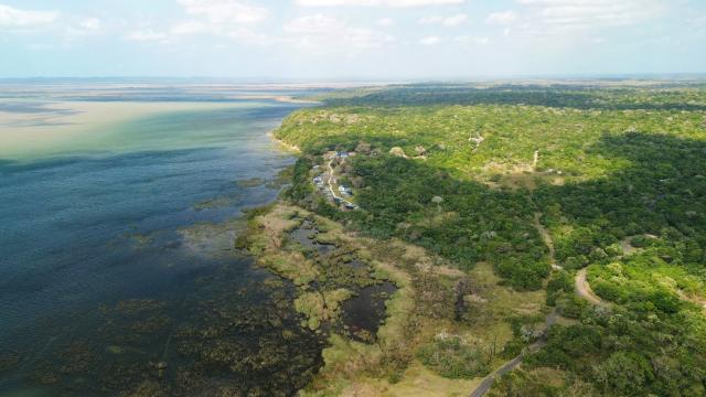 (260821) -- KWAZULU-NATAL, Aug. 21, 2026 (Xinhua) -- An aerial drone photo taken on Aug. 20, 2026 shows a view of Lake St. Lucia at iSimangaliso Wetland Park in KwaZulu-Natal Province, South Africa. Located in northern KwaZulu-Natal Province, the park features a rich diversity of ecosystems, including lakes, wetlands, beaches and coastal forests. It was inscribed on the UNESCO World Heritage List in 1999. (Xinhua/Chen Wei)