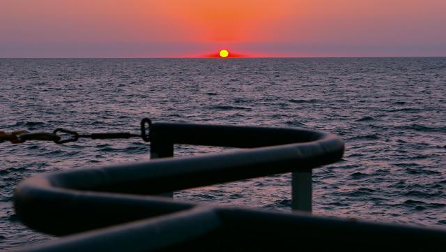 (260821) -- BAKU, Aug. 21, 2026 (Xinhua) -- This photo taken on Aug. 18, 2026 shows a sunset view seen from a geophysical survey vessel of Caspian Geophysical Company, a China-Azerbaijan joint venture, in the Caspian Sea near Baku, Azerbaijan. (Xinhua/Chen Junfeng)