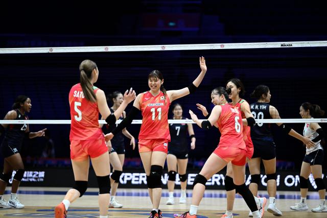 (260821) -- TIANJIN, Aug. 21, 2026 (Xinhua) -- Players of Japan celebrate during the pool C match between Japan and China's Hong Kong at AVC Women's Volleyball Continental Championship in Tianjin, China, Aug. 21, 2026. (Xinhua/Sun Fanyue)