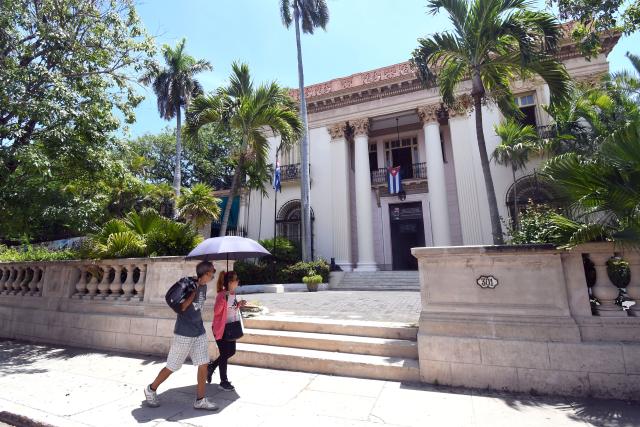 (260821) -- HAVANA, Aug. 21, 2026 (Xinhua) -- People walk past the Cuban Institute of Friendship with the Peoples in Havana, capital of Cuba, on Aug. 21, 2026. Cuban Foreign Minister Bruno Rodriguez on Thursday denounced Washington's increased sanctions against Cuban officials and entities, accusing the United States of deliberately seeking to strangle the island's economy and undermining the government's ability to provide basic services. (Photo by Joaquin Hernandez/Xinhua)