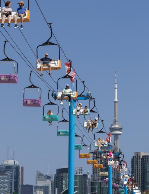 (260822) -- TORONTO, Aug. 22, 2026 (Xinhua) -- Visitors take the Sky Ride at the 2026 Canadian National Exhibition (CNE) in Toronto, Canada, on Aug. 21, 2026. As one of the largest community events in Canada, the annual event runs from Aug. 21 to Sept. 7. (Photo by Zou Zheng/Xinhua)