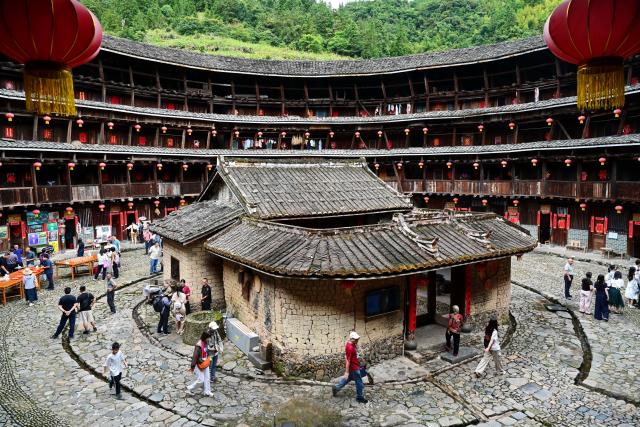 (260822) -- BEIJING, Aug. 22, 2026 (Xinhua) -- This photo taken on Aug. 20, 2026 shows a view of the Yuchang Tulou in Shuyang Town, Nanjing County, Zhangzhou City, southeast China's Fujian Province. In recent years, Nanjing County has been revitalizing its historical Tulou compounds and Hakka heritage by integrating culture and tourism, upgrading tourist attractions and introducing immersive experiences to draw more visitors. (Xinhua/Lin Shanchuan)