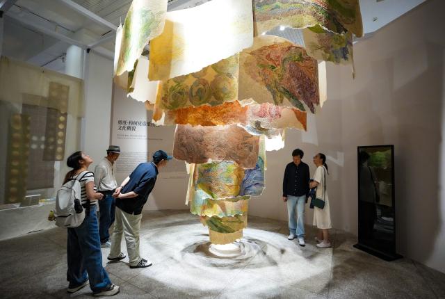 (260822) -- BEIJING, Aug. 22, 2026 (Xinhua) -- People visit the 8th Kunming Art Biennale at Yunnan Art Museum in Kunming, southwest China's Yunnan Province, Aug. 20, 2026. (Xinhua/Chen Xinbo)