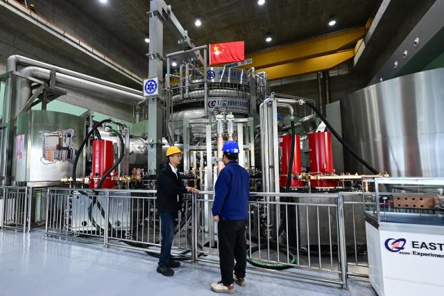 (260822) -- HEFEI, Aug. 22, 2026 (Xinhua) -- Scientists work on the upgrading of Experimental Advanced Superconducting Tokamak (EAST) in Hefei, east China's Anhui Province, on April 28, 2026. (Xinhua/Zhou Mu)