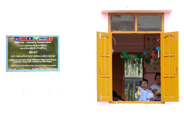 (260822) -- AYEYARWADY REGION, Aug. 22, 2026 (Xinhua) -- Children are seen inside a pre-school building of a model village project funded by the Lancang-Mekong Cooperation (LMC) Special Fund 2024 in Ohnpinsu village, Nyaungdon township in Ayeyarwady region, Myanmar, Aug. 20, 2026. TO GO WITH "Feature: Myanmar's delta village finds new livelihoods with LMC support" (Xinhua/Myo Kyaw Soe)