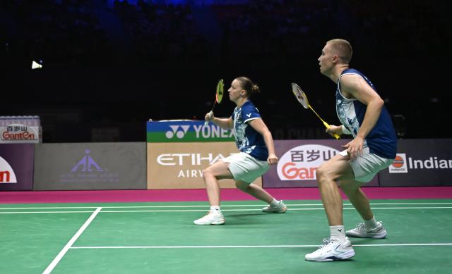 (260822) -- NEW DELHI, Aug. 22, 2026 (Xinhua) -- Thom Gicquel/Delphine Delrue (L) of France compete during the mixed doubles semifinal match between Jiang Zhenbang/Wei Yaxin of China and Thom Gicquel/Delphine Delrue of France at BWF World Championships in New Delhi, India, Aug. 22, 2026. (Photo by Javed Dar/Xinhua)