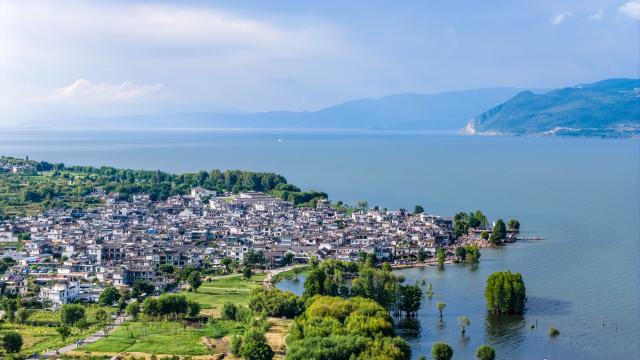 (260822) -- DALI, Aug. 22, 2026 (Xinhua) -- An aerial drone photo shows a view of the Erhai Lake ecological corridor in Dali, southwest China's Yunnan Province, Aug. 21, 2026. The Erhai Lake ecological corridor has entered its peak tourism season during the summer holiday, with cycling becoming a popular choice for many visitors to tour the lake and get close to the nature.
   Local authorities have been continuously upgrading the infrastructure and supporting services along the corridor to create more cultural and tourism experiences. In the first seven months of 2026, the corridor has received more than 17 million visitors. (Xinhua/Hu Chao)