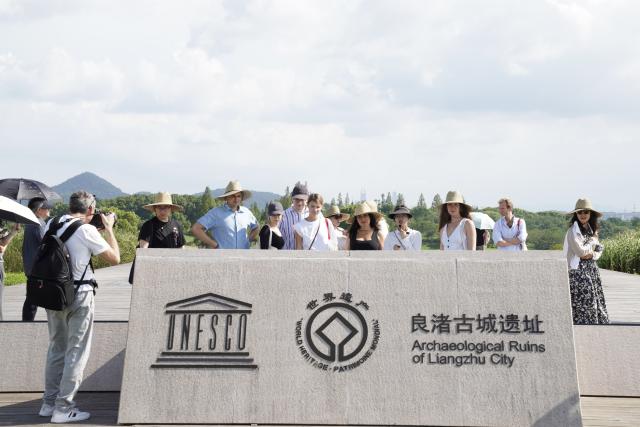 (260822) -- HANGZHOU, Aug. 22, 2026 (Xinhua) -- Members of a joint China-Russia media delegation visit the Archaeological Ruins of Liangzhu City Park in Hangzhou, east China's Zhejiang Province, Aug. 21, 2026. The delegation visited Hangzhou from Aug. 20 to 22, experiencing the charm of Chinese culture. (Xinhua/Lu Jinbo)