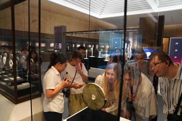 (260822) -- HANGZHOU, Aug. 22, 2026 (Xinhua) -- Members of a joint China-Russia media delegation visit the Liangzhu Museum in Hangzhou, east China's Zhejiang Province, Aug. 21, 2026. The delegation visited Hangzhou from Aug. 20 to 22, experiencing the charm of Chinese culture. (Xinhua/Lu Jinbo)