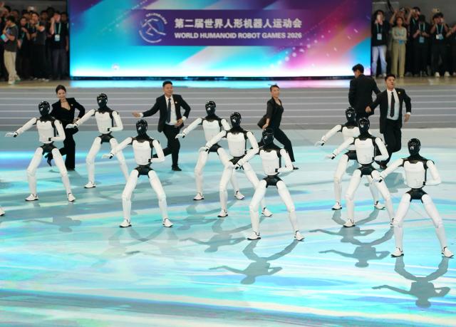 (260822) -- BEIJING, Aug. 22, 2026 (Xinhua) -- Humanoid robots perform during the opening ceremony of the 2nd World Humanoid Robot Games in Beijing, capital of China, Aug. 22, 2026. (Xinhua/Zhang Chenlin)