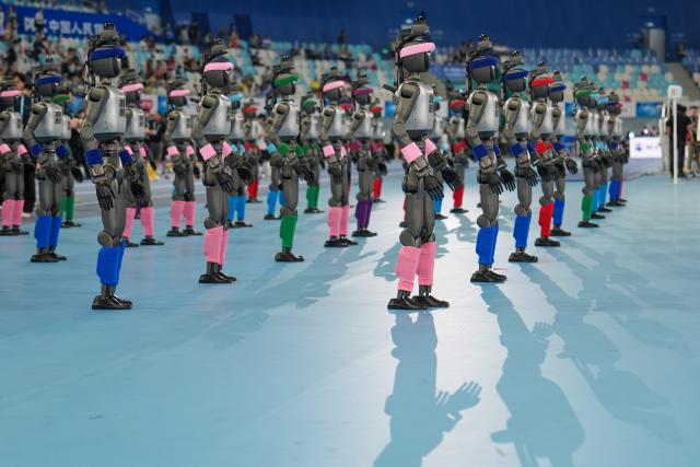 (260822) -- BEIJING, Aug. 22, 2026 (Xinhua) -- Humanoid robots are ready to perform before the opening ceremony of the 2nd World Humanoid Robot Games in Beijing, capital of China, Aug. 22, 2026. (Xinhua/Ju Huanzong)