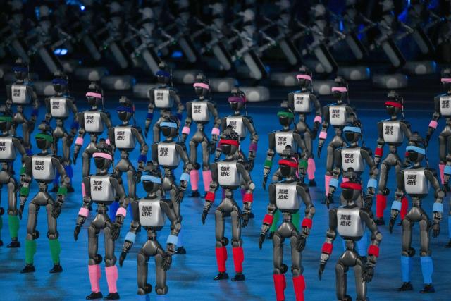 (260822) -- BEIJING, Aug. 22, 2026 (Xinhua) -- Humanoid robots perform during the opening ceremony of the 2nd World Humanoid Robot Games in Beijing, capital of China, Aug. 22, 2026. (Xinhua/Ju Huanzong)