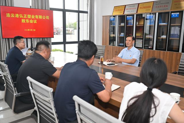 (260822) -- LIANYUNGANG, Aug. 22, 2026 (Xinhua) -- Zhong Baijun discusses development plans with representatives of neighboring villages at a circular economy industrial park in Xijidang Village, Zhewang Town of Lianyungang City, east China's Jiangsu Province, Aug. 19, 2026. Zhong Baijun, Party secretary of Xijidang Village and head of the village committee, has spent 28 years serving his hometown in Zhewang Town of Lianyungang City, east China's Jiangsu Province.
  When he returned to the village to take up his post in 1998, the village collective had no industries and was in debt. Most residents made a living from farming, and many younger villagers left home to seek work elsewhere.
  Looking for new ways to develop the local economy, Zhong and other village officials traveled to other areas to explore potential industries. Leveraging the village's coastal location and the relatively abundant stock of discarded fishing nets, they gradually developed a nylon pellet processing industry.
  The industry initially grew through small workshops. To restructure the sector, the village invested 120 million yuan (about 17.9 million U.S. dollars) in building a standardized industrial park and later developed a model that allowed residents to benefit from the industry's growth through shareholding, local employment and dividends. By 2025, Xijidang's total industrial output reached 2.5 billion yuan (about 372 million U.S. dollars). The industry also created jobs for more than 1,600 local residents.
  As the collective economy grew, the village put more resources into improving community well-being. It organized cultural and sports activities, as well as model-family award campaigns, giving residents more opportunities to take part in community events.
  Over the past 28 years, Zhong has witnessed the village's industries expand, employment opportunities increase and collective income rise. "We should put the people's concerns first," Zhong said. (Xinhua/Ji Chunpeng)