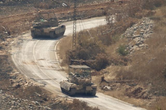 (260822) -- CHAQRA, Aug. 22, 2026 (Xinhua) -- Israeli army tanks are seen in Chaqra, southern Lebanon, Aug. 21, 2026. (Photo by Ali Hashisho/Xinhua)