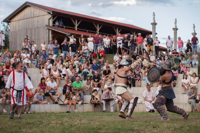 (260822) -- PTUJ, Aug. 22, 2026 (Xinhua) -- Participants dressed in gladiators demonstrate their battle skills during the Roman Games Festival in Ptuj, Slovenia, Aug. 22, 2026. The 19th edition of the Roman Games festival kicked off on Friday in Ptuj and will last till Aug. 23. (Photo by Zeljko Stevanic/Xinhua)