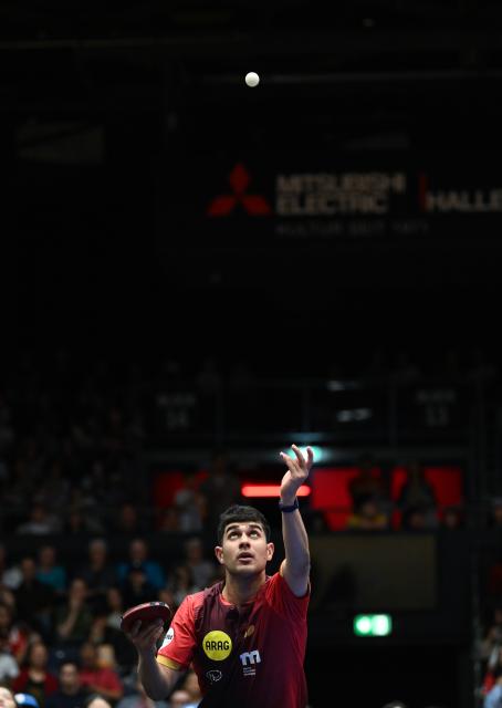 (260823) -- DUSSELDORF, Aug. 23, 2026 (Xinhua) -- Kanak Jha of Borussia Dusseldorf serves against Filip Zeljko of TSV Bad Konigshofen during the Bundesliga table tennis match between Borussia Dusseldorf and TSV Bad Konigshofen in Dusseldorf, Germany, Aug. 22, 2026. (Xinhua/Zhang Haofu)