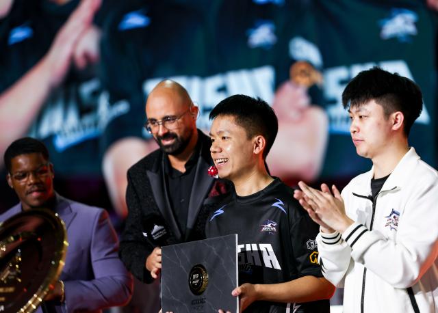 (260823) -- PARIS, Aug. 23, 2026 (Xinhua) -- Wang Hao (N9, 2nd R) of Baisha Gaming reacts after the grand final of Crossfire between Baisha Gaming of China and Team Liquid at the 2026 Esports World Cup in Paris, France, Aug. 22, 2026. (Xinhua/Wu Huiwo)