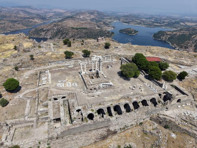 (260823) -- IZMIR, Aug. 23, 2026 (Xinhua) -- An aerial drone photo taken on Aug. 22, 2026 shows a view of the Bergama ancient city in Bakircay Basin in Izmir, Türkiye. Known as Pergamon in antiquity and designated a UNESCO World Heritage site, Bergama occupies a strategic position overlooking fertile lands and vital water resources. At its heart lies the Bergama Acropolis, a landmark distinguished by its multilayered history spanning the Hellenistic, Roman, Byzantine, Beylik, and Ottoman periods. (Mustafa Kaya/Handout via Xinhua)