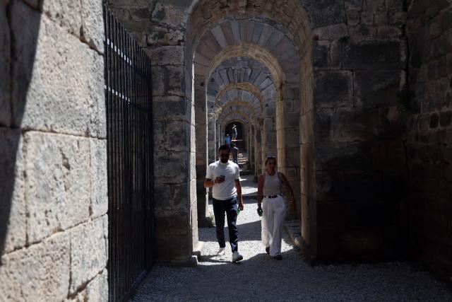 (260823) -- IZMIR, Aug. 23, 2026 (Xinhua) -- Tourists visit the Bergama ancient city in Bakircay Basin in Izmir, Türkiye, on Aug. 22, 2026. Known as Pergamon in antiquity and designated a UNESCO World Heritage site, Bergama occupies a strategic position overlooking fertile lands and vital water resources. At its heart lies the Bergama Acropolis, a landmark distinguished by its multilayered history spanning the Hellenistic, Roman, Byzantine, Beylik, and Ottoman periods. (Mustafa Kaya/Handout via Xinhua)