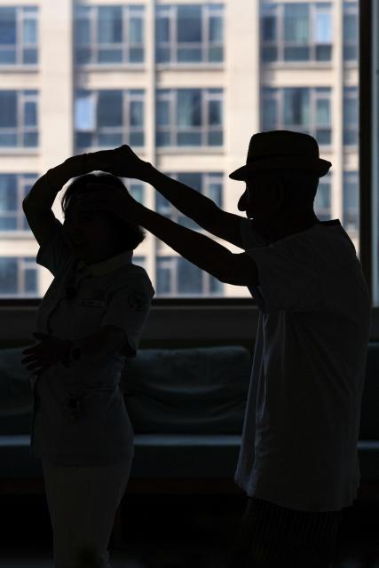 (260823) -- HUZHOU, Aug. 23, 2026 (Xinhua) -- Shen Wanting (L) and a senior resident are filmed during a video shoot at the Shushan Healthcare Center in Huzhou City, east China's Zhejiang Province, Aug. 17, 2026.
  Senior residents at the Shushan Healthcare Center, an elderly care center in Huzhou, Zhejiang Province, sometimes misunderstand one another during daily conversations because of their advanced age. These moments inspired Shen Wanting, a post-95 nurse, and five colleagues of similar age to create micro dramas featuring these elderly residents and their daily lives at the center. 
  Five senior residents, whose average age is over 80, are regular cast members, and the oldest is over 90. 
  After gaining attention online, the production team has continued to release micro drama episodes. Since June 2025, they have produced over 160 episodes. (Photo by Yi Fan/Xinhua)