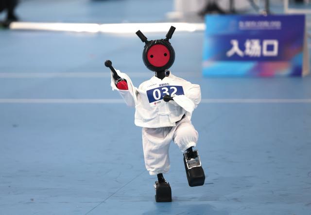 (260823) -- BEIJING, Aug. 23, 2026 (Xinhua) -- Robot of High Torque Robotics competes during the Tai Chi event of the 2nd World Humanoid Robot Games in Beijing, capital of China, Aug. 23, 2026. (Xinhua/Zhai Yifan)