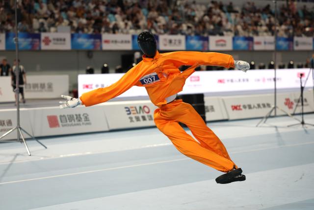 (260823) -- BEIJING, Aug. 23, 2026 (Xinhua) -- Robot of Beijing AGIbot Team competes during the Tai Chi event of the 2nd World Humanoid Robot Games in Beijing, capital of China, Aug. 23, 2026. (Xinhua/Zhai Yifan)