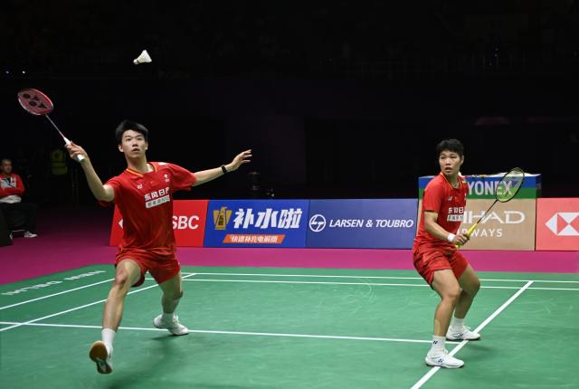 (260823) -- NEW DELHI, Aug. 23, 2026 (Xinhua) -- Feng Yanzhe (L)/Huang Dongping of China compete during the mixed doubles final match against Thom Gicquel/Delphine Delrue of France at BWF World Championships in New Delhi, India, Aug. 23, 2026. (Xinhua/Javed Dar)