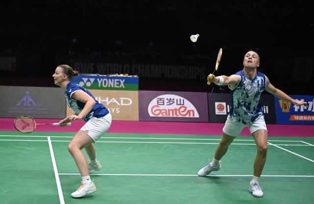 (260823) -- NEW DELHI, Aug. 23, 2026 (Xinhua) -- Thom Gicquel (R)/Delphine Delrue of France compete during the mixed doubles final match against Feng Yanzhe/Huang Dongping of China at BWF World Championships in New Delhi, India, Aug. 23, 2026. (Xinhua/Javed Dar)