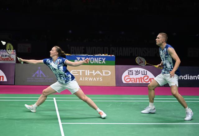 (260823) -- NEW DELHI, Aug. 23, 2026 (Xinhua) -- Thom Gicquel/Delphine Delrue (L) of France compete during the mixed doubles final match against Feng Yanzhe/Huang Dongping of China at BWF World Championships in New Delhi, India, Aug. 23, 2026. (Xinhua/Javed Dar)