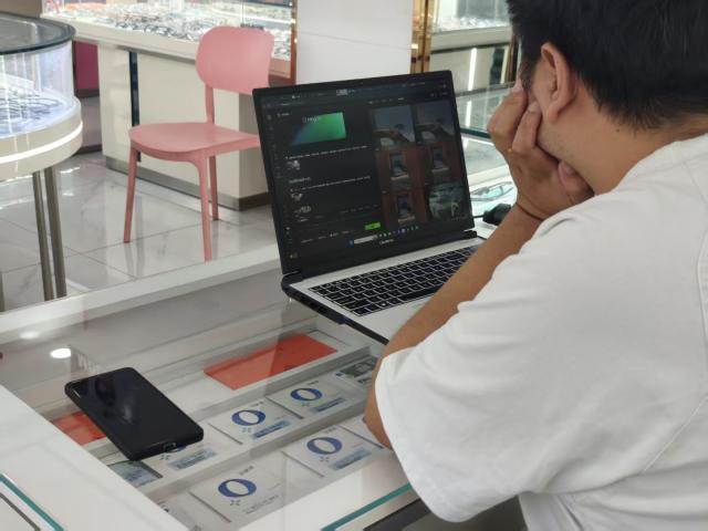 (260823) -- CHENGDU, Aug. 23, 2026 (Xinhua) -- Chen Aijun makes AI videos in an optical shop in Chengdu, southwest China's Sichuan Province, Aug. 14, 2026.
  TO GO WITH "Feature: When a Chinese mythic world travels without translation" (Xinhua/Lu Youyi)