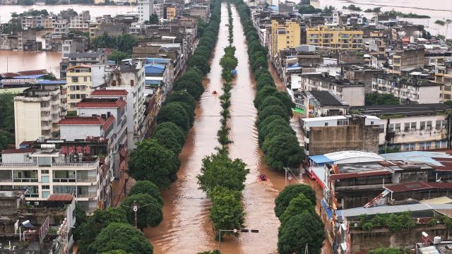 (260823) -- NINGMING, Aug. 23, 2026 (Xinhua) -- An aerial drone photo taken on Aug. 23, 2026 shows a view of Ningming County, in south China's Guangxi Zhuang Autonomous Region. For days, Ningming County has been battered by typhoon-triggered heavy rainfall. Response forces have pooled their efforts to urgently evacuate stranded residents. (Xinhua/Zhou Hua)