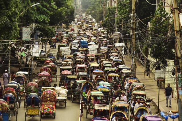 (260823) -- DHAKA, Aug. 23, 2026 (Xinhua) -- This photo taken on Aug. 22, 2026 shows rickshaws on a street in Dhaka, Bangladesh. In 2023, UNESCO announced the inclusion of Bangladesh's iconic rickshaws and rickshaw painting in Dhaka on the Representative List of the Intangible Cultural Heritage of Humanity. (Photo by Habibur Rahman/Xinhua)