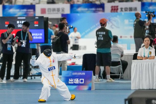 (260823) -- BEIJING, Aug. 23, 2026 (Xinhua) -- The robot of Jingshan School Intercity Tech Team competes during the final of Tai Chi of the 2nd World Humanoid Robot Games in Beijing, capital of China, Aug. 23, 2026. (Xinhua/Ju Huanzong)