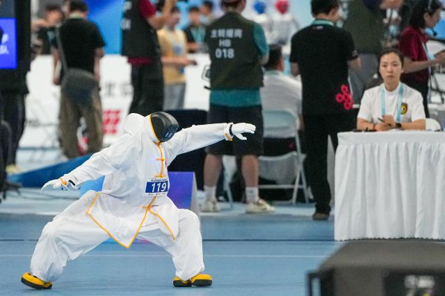 (260823) -- BEIJING, Aug. 23, 2026 (Xinhua) -- The robot of Jingshan School Intercity Tech Team competes during the final of Tai Chi of the 2nd World Humanoid Robot Games in Beijing, capital of China, Aug. 23, 2026. (Xinhua/Ju Huanzong)
