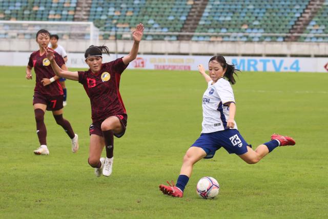 (260823) -- YANGON, Aug. 23, 2026 (Xinhua) -- Matsuo Yumemi (R) of Ayeyawady FC Women competes during a preliminary match between New Taipei City Hang Yuan FC of Chinese Taipei and Ayeyawady FC Women of Myanmar at the 2026-2027 AFC Women's Champions League in Yangon, Myanmar, Aug. 23, 2026. (Xinhua/Myo Kyaw Soe)