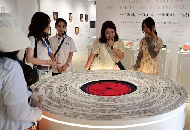 (260823) -- FUZHOU, Aug. 23, 2026 (Xinhua) -- People visit the China Film Music Exhibition Hall on Gulangyu Island in Xiamen, southeast China's Fujian Province, Aug. 22, 2026.
  Leveraging its rich historical and cultural heritage, the city of Xiamen has strived to bring traditional heritage into modern-day life and developed a range of cultural spaces that blend ancient traditions with modern styles. (Xinhua/Lin Shanchuan)