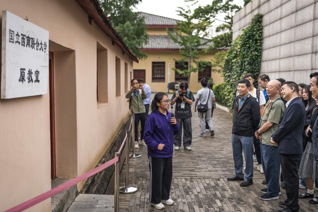 (260823) -- KUNMING, Aug. 23, 2026 (Xinhua) -- Members of a Macao media delegation visit the former site of the National Southwest Associated University at Yunnan Normal University in Kunming, southwest China's Yunnan Province, Aug. 22, 2026.
  The Macao media delegation is on a visit to Kunming, Dali, and Lijiang in Yunnan Province from Aug. 21 to 27. The visit aims to strengthen exchanges and cooperation between Yunnan and Macao media. (Xinhua/Wang Guansen)