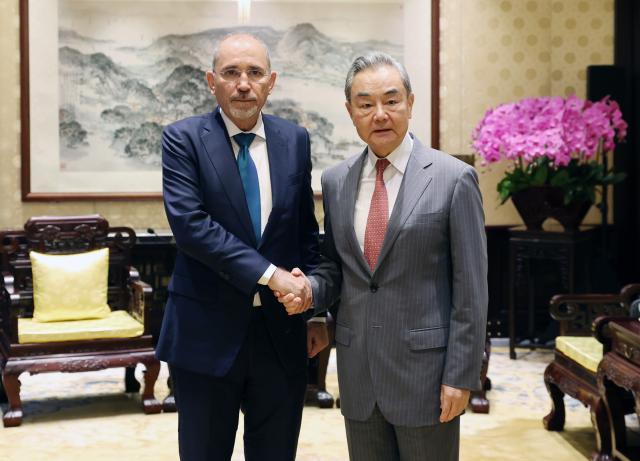 (260823) -- BEIJING, Aug. 23, 2026 (Xinhua) -- Chinese Foreign Minister Wang Yi, also a member of the Political Bureau of the Communist Party of China Central Committee, meets with Jordanian Deputy Prime Minister and Foreign Minister Ayman Safadi, who is accompanying Jordan's King Abdullah II on a visit to China, in Beijing, capital of China, Aug. 23, 2026. (Xinhua/Yao Dawei)
