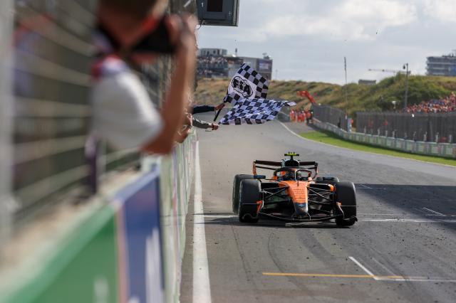 (260824) -- ZANDVOORT, Aug. 24, 2026 (Xinhua) -- McLaren's British driver Lando Norris crosses the finish line during the Formula 1 Dutch Grand Prix Race at Zandvoort Circuit, near Amsterdam, the Netherlands, Aug. 23, 2026. (Photo by Qian Jun/Xinhua)