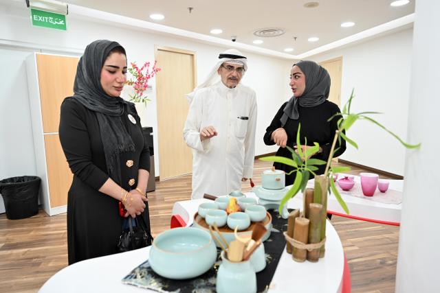 (260824) -- KUWAIT CITY, Aug. 24, 2026 (Xinhua) -- People participate in the Chinese & Kuwaiti Tea Art and Treats Tasting event at the China Cultural Center in Kuwait in Hawalli Governorate, Kuwait, Aug. 23, 2026. More than 150 people gathered Sunday evening here for the event, where they savored teas and sweets and learned about tea-making traditions in both countries.
   Jointly organized by the China Cultural Center in Kuwait and Kuwait's National Council for Culture, Arts and Letters (NCCAL), the event was part of Kuwait's 18th Summer Cultural Festival. It aimed to introduce Chinese and Kuwaiti tea traditions and promote cultural and people-to-people exchanges between the two countries. (Photo by Asad/Xinhua)