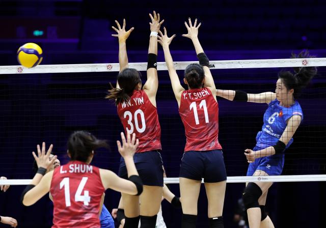 (260824) -- TIANJIN, Aug. 24, 2026 (Xinhua) -- Pham Quynh Huong (1st R) of Vietnam spikes the ball during the pool C match between Vietnam and China's Hong Kong at AVC Women's Volleyball Continental Championship in Tianjin, China, Aug. 24, 2026. (Xinhua/Sun Fanyue)