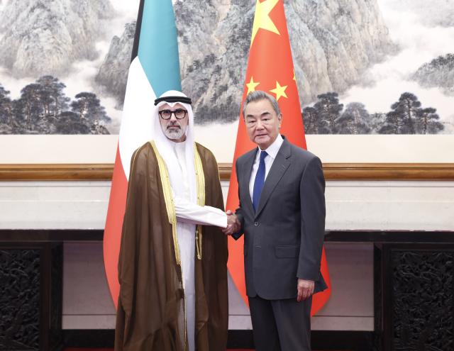 (260824) -- BEIJING, Aug. 24, 2026 (Xinhua) -- Chinese Foreign Minister Wang Yi, also a member of the Political Bureau of the Communist Party of China Central Committee, holds talks with Sheikh Jarrah Jaber Al-Ahmad Al-Sabah, Minister of Foreign Affairs of Kuwait, in Beijing, capital of China, Aug. 24. 2026. (Xinhua/Pang Xinglei)